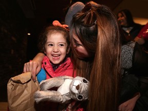 CALGARY.;  NOVEMBER 20, 2015  -- Syrian refugee Maysa Yousef, 3, is greeted at the Calgary International Airport by family member Mishleen William. Photo Leah Hennel, Calgary Herald