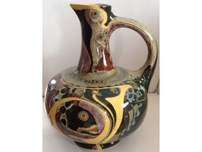 This Dutch pitcher was likely made at the request of the Dewars Whiskey distillery.