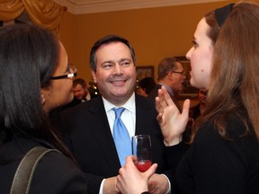 Alberta Conservative MP Jason Kenney in conversation with a pair of Ontario legislative interns at a reception hosted by the British high commissioner on Thursday, December 3, 2015, at Earnscliffe for the Scottish Society of Ottawa. (Caroline Phillips / Ottawa Citizen)