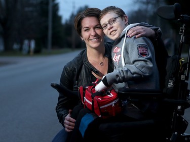 Jonathan Pitre, 15, photographed with this mother Tina Boileau, reflects on his eventful year .