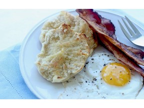 This Aug. 3, 2015 photo shows English muffins with eggs and bacon in Concord, N.H.  Homemade English muffins are easy to make and taste just as good as the store-bought variety.