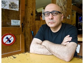 Author Rawi Hage's new novel, Cockroach, comes out end of August. It's about a thief living in the immigrant community of Montreal. Hage seen here on Wednesday, July 23, 2008 in Montreal's plateau district.  THE GAZETTE/Dave Sidaway