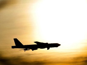 A B-52 Stratofortress flies just under the sun after flying a routine sortie at Minot Air Force Base, N.D., Nov. 20, 2012. Pilots of the BUFF are required to log certain amounts of hours depending on their skill level per month and to be ready to “OWN IT” at a moment’s notice.