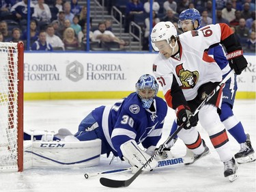 Ottawa Senators right wing Mark Stone (61) tries to shoot against Tampa Bay Lightning goalie Ben Bishop (30) during the first period.