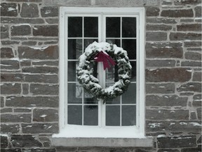 OTTAWA, ONT.:  DECEMBER 9,  2009 STORM Manotick Ont Christmas wreaths at Watson's Mill in Manotick are snow covered from todays storm which is expected to dump over 20 cms of snow in the Ottawa area.   (PHOTO by PAT McGRATH--THE OTTAWA CITIZEN) for CITY standalone ASSIGNMENT NUMBER 00000