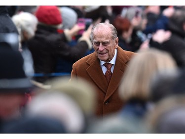 Britain's Phince Philip, the Duke of Edinburgh arrives ahead of other members of the royal family for a traditional Christmas Day Church Service at Sandringham in eastern England, on December 25, 2015.