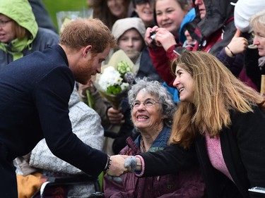 Britain's Prince Harry greets wellwishers after attending a traditional Christmas Day Church Service at Sandringham in eastern England, on December 25, 2015.