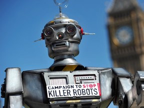 A file photo taken on April 23, 2013 shows a mock "killer robot" pictured in central London during the launching of the Campaign to Stop "Killer Robots," which calls for the ban of lethal robot weapons that would be able to select and attack targets without any human intervention. A group of top tech leaders, including British scientist Stephen Hawking and Apple co-founder Steve Wozniak, on July 28, 2015 issued a stern warning against the development of so-called killer robots. Autonomous weapons, which use artificial intelligence to select targets without human intervention, have been described as "the third revolution in warfare, after gunpowder and nuclear arms," wrote around 1,000 technology chiefs in an open letter.