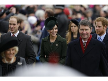 Britain's Prince William, left, his wife Kate the Duchess of Cambridge, center, and Prince Harry, background right, arrive with family members to attend the traditional Christmas Day church service, at St. Mary Magdalene Church in Sandringham, England,  Friday, Dec. 25, 2015.