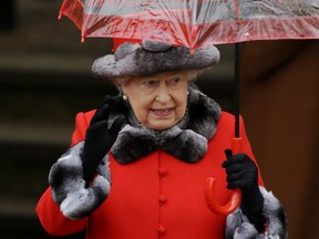 Britain's Queen Elizabeth II waves at the crowd of well-wishers as she leaves after attending the British royal family's traditional Christmas Day church service at St. Mary Magdalene Church in Sandringham, England, Friday, Dec. 25, 2015.