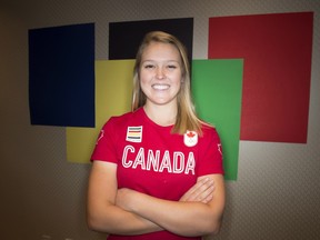 Canadian golfer Brooke Henderson poses in Toronto, Thursday. Henderson hopes to continue her ascent on the top women's golf circuit and also lead Canada to the podium when the sport makes its return to the Olympic program next summer in Rio.