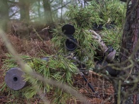 A Canadian Armed Forces sniper adjusts his scope while participating in Exercise Without Warning in the training area of Glebokie, Poland on December 17, 2015 during Operation REASSURANCE.

Photo: Corporal Nathan Moulton, Land Task Force Imagery, OP REASSURANCE
RP001-2015-0065-009