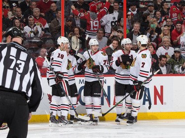 Patrick Kane #88 of the Chicago Blackhawks celebrates his second period power play goal against the Ottawa Senators with teammates Jonathan Toews #19, Artemi Panarin #72, Duncan Keith #2 and Brent Seabrook #7.