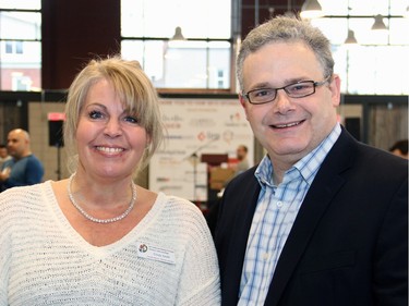 Cindy Smith, executive director of the Caring and Sharing Exchange, with its board president, Paul Lalonde, a partner with law firm Emond Harnden, at the Horticulture Building at Lansdowne on Friday, December 18, 2015, for the organization's Christmas Exchange Program food hamper packing day. (Caroline Phillips / Ottawa Citizen)