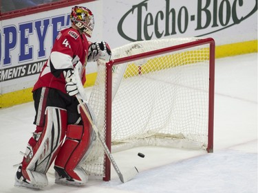 Ottawa Senators goalie Craig Anderson skates from behind the net as the puck crosses the goal line on a shot from Los Angeles Kings centre Tyler Toffoli during second period action.