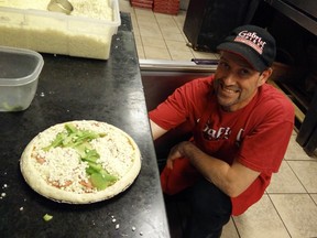 Darren, aka Pizza Dad, with a specially crafted "Upvote" Imgur pizza.