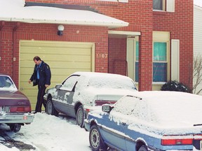 Police check the Orleans house of Wayne Ratte and Paulette Seguin on Christmas Day, 1990. Throughout the night of Dec. 24, Ratte, armed with a shotgun and a hunting rifle, held dozens of police at bay for more than 12 hours.