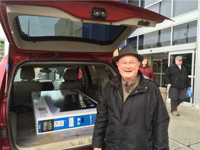 Dr. Wilbert Keon, retired heart surgery pioneer and Canadian senator, with his big screen TV outside an Ottawa Best Buy on Boxing Day.