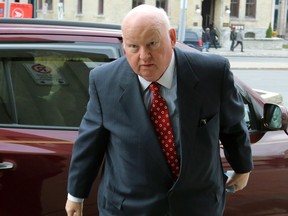 Sen. Mike Duffy arrives at the courthouse on Nov. 25.