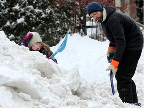 Enough with the shovelling already! Five-year-old Ophelia Quinn's face says it all as she takes a break from shovelling out her  Glebe driveway with her dad, Tremain Quinn, on Wednesday morning.