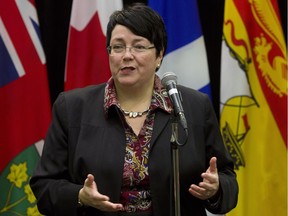Newfoundland and Labrador Finance Minister Cathy Bennett talks to reporters before the start of a meeting with Federal Finance Minister Bill Morneau and his provincial and territorial counterparts.