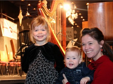 Five-year-old Marion Parizeau with her mom, NAC Orchestra violinist NoÈmi  Racine Gaudreault, and baby sister Lou Parizeau, 15 months, were at the Christmas FanFair Concert presented by the National Arts Centre Orchestra Players' Association in the NAC Main Foyer on Sunday, December 13, 2015. Their dad/husband, NAC Orchestra bassoonist Vincent Parizeau, played that day.