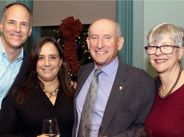 From left, Doug Wotherspoon, a vice president at Algonquin College, with his wife, Dr. Susan Fennell, and former Ottawa city councillor and acting mayor Allan Higdon with his wife, Willa Rea, at a holiday reception hosted by Mayor Jim Watson at the Mayor's Boardroom at City Hall on Wednesday, December 18, 2015.