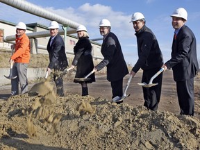 From left: Jonathan Westeinde, CEO Windmill Development Group; Jeff Westeinde, Windmill chairman; Maryse Gaudreault, MLA for Hull; Maxime Pedneaud-Jobin, mayor of Gatineau; Andrew Decontie of Decontie Construction; and Rodney Wilts, partner at Windmill, take part in the official groundbreaking ceremony for Zibi on Dec. 10, 2015.
