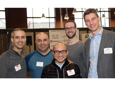 From left, Phil Dame (COO of Ramius Corporation), Justin Shimoon (CEO of AffinityClick), Alfred Jay (CEO of Ramius Corporation), Brandon Weselnuk (CEO of Tattoo Hero), Ross Rowan-Legg (CIBC Wood Gundy), all of whom are members of the Caring and Sharing Exchange campaign cabinet, at the charity's food hamper packing event held Friday, December 18, 2015, at the Horticulture Building at Lansdowne. (Caroline Phillips / Ottawa Citizen)