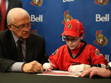 General manager of the Ottawa Senators, Bryan Murray (l) Jonathan Pitre as a pro scout for one day at the Canadian Tire Centre in Ottawa, November 20, 2014.