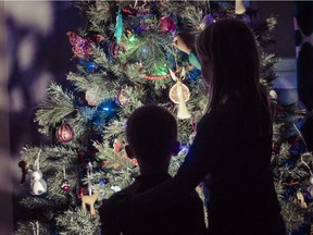Grace Seymour, daughter of Andrew Seymour,  is photographed decorating her Christmas Tree with her younger brother, Charlie, at their home in Kanata Friday December 18, 2015. (Darren Brown/Ottawa Citizen) FOR SIBLEY SACRED