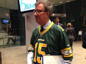 Mayor Jim Watson arrives at the Wednesday city council meeting in an Edmonton Eskimos jersey, his end of a Grey Cup bet with Edmonton mayor Don Iveson, who will be sending money to the Ottawa Food Bank as his end of the bet. Said Watson: "I don't feel I really lost. I get a nice jersey, and the food bank gets some funds."