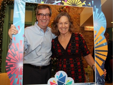 It's still a year away but the logo for the upcoming 2017 Ottawa celebrations made an appearance at a holiday reception Mayor Jim Watson, seen with 1984 Olympic double-medalist Sue Holloway, hosted at the Mayor's Boardroom at City Hall on Wednesday, December 16, 2015. (Caroline Phillips / Ottawa Citizen)