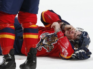 Florida Panthers forward Jaromir Jagr (68) rolls on the ice after being injured by a stick to the face during the first period.