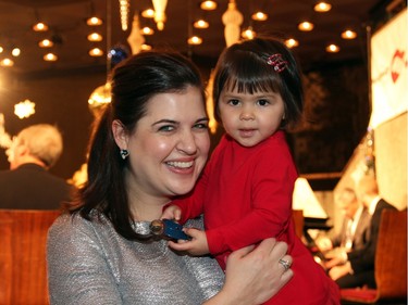 Jessica Linnebach, associate concertmaster with the National Arts Centre Orchestra, seen with her delightful daughter, Hanako Kawasaki, age two, at the orchestra's Christmas FanFair Concert held in the NAC Main Foyer on Sunday, December 13, 2015.