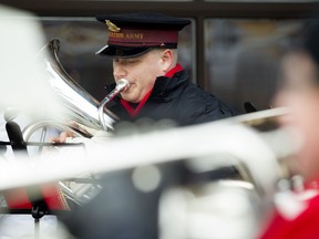 Jordan McDormand and his bandmates perform Christmas songs to entertain shoppers out and about in the ByWard Market on Saturday, Dec. 19, 2015.