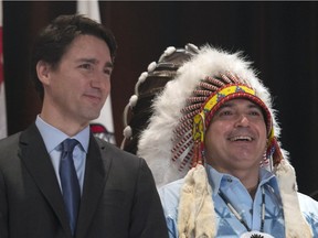 Prime Minister Justin Trudeau and AFN National Chief Perry Bellegarde speak as they arrive at the Assembly of First Nations Special Chiefs Assembly in Gatineau, Tuesday December 8, 2015.