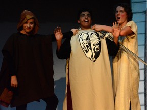 Kate Counsel performs as Concorde (L), Ali Shukri performs as Sir Lancelot (M), and Ryan Pedersen performs as Prince Herbert (R), during Merivale High School's Cappies production of Spamalot.