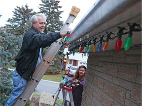 Kathryn Kalinger and her husband, Peter, have to reinstall new Christmas lights after a recall was made on their previous lights.