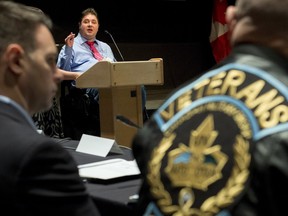 Minister of Veterans Affairs Kent Hehr speaks to stakeholders and veterans at a stakeholder summit at the Canadian War Museum in Ottawa on Wednesday, Dec. 2, 2015.