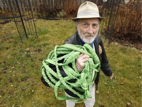 Kevin Murray shows off the punctured garden hose.