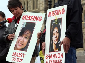 Laurie Odjick holds a sign with photo of her missing daughter, Maisy, who went missing along with Shannon Alexander in 2008 at age 16. Odjick was taking part in a rally on Parliament Hill in Ottawa on Friday, October 4, 2013 by the Native Women's Assoiciation of Canada honouring the lives of missing and murdered Aboriginal women and girls.