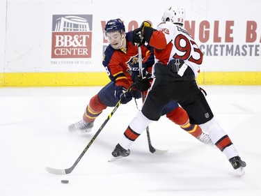 Florida Panthers right wing Logan Shaw (48) and Ottawa Senators center Mika Zibanejad (93) battle for the puck during the second period.
