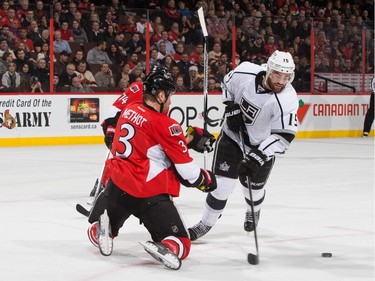 Marc Methot #3 of the Ottawa Senators blocks a shot attempt by Andy Andreoff #15 of the Los Angeles Kings.