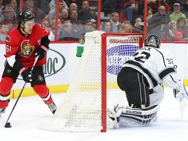 Mark Stone of the Ottawa Senators tries a wraparound against Jonathan Quick of the Los Angeles Kings during first period action.