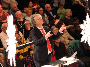 Matthew Larkin, choral director of the Christ Church Choir of Men and Boys, conducts the singers during the free Christmas FanFair Concert, presented by the National Arts Centre Orchestra Players' Association in the NAC Main Foyer on Sunday, December 13, 2015.