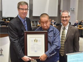 Mayor Jim Watson and Knoxdale-Merivale ward Coun. Keith Egli present a Mayor's City Builder Award to Joseph "Joe" Oombash.