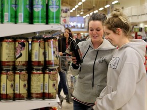 Megan Dowling and Breanna Belway (right) seemed almost giddy at the thought of being able to pick up a couple of craft beers while grocery shopping at the College Square Loblaws on Tuesday, Dec. 15, 2015.