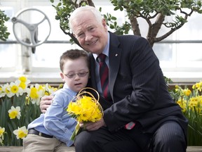 Michael Meehan presents Gov. Gen. David Jonhston with a bouquet of daffodils in this April 2014 photo.