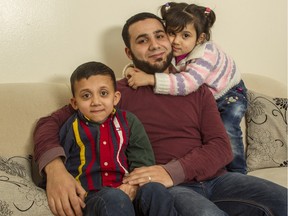 Mohammad Al Faraj with his children Mahmoud, 8, and Safa, 3. Along with Mohammad's wife, Rasha, the Syrian refugee family arrived in Ottawa in June, following a three-year wait in Lebanon.
